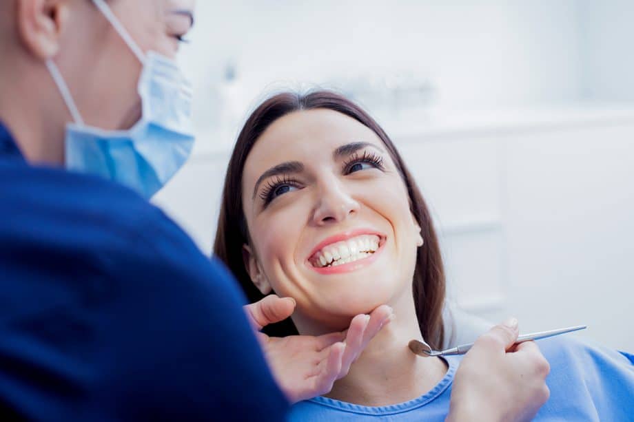 woman smiles at dentist