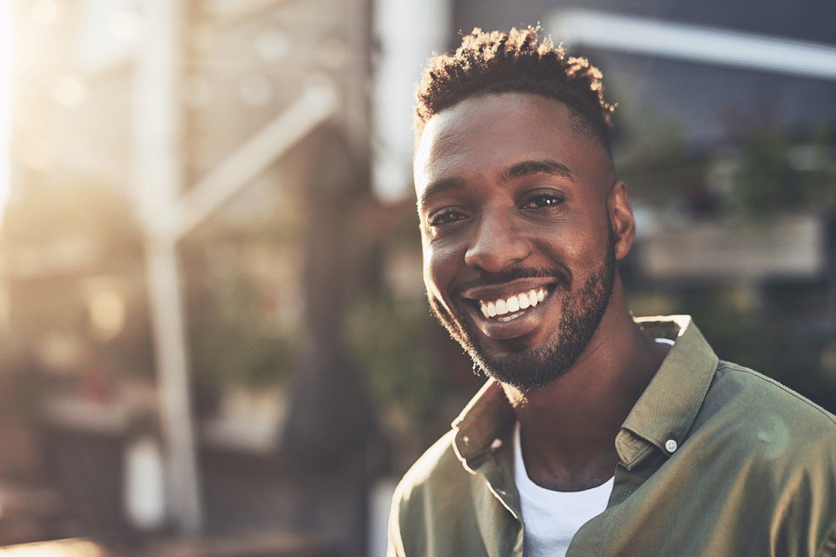 a man smiles with white teeth